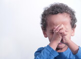 boy praying to God with hands held together with closed eyes on white background stock photo