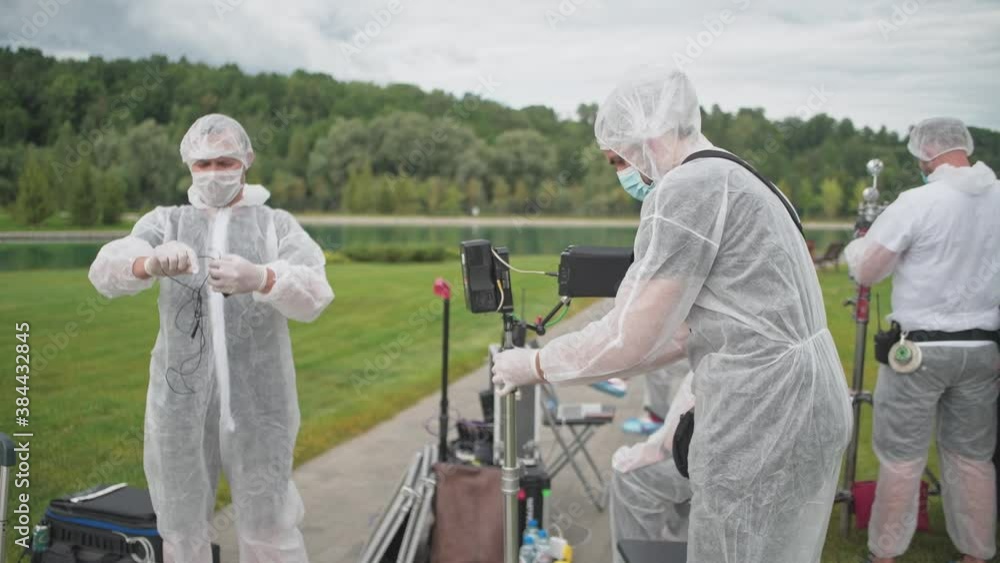 A team of filmmakers at work. Compliance with antiviral safety measures during quarantine. Personal protective equipment against coronavirus. A team of filmmakers at work. Compliance with antiviral safety measures during quarantine. Personal protective equipment against coronavirus.