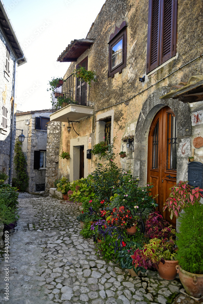 A narrow street between the old houses of Fumone, a medieval village in the province of Frosinone, Italy.