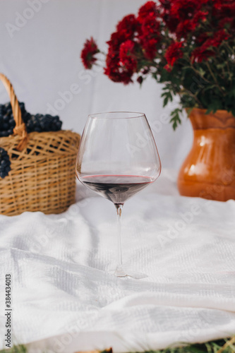 glass of wine and flowers