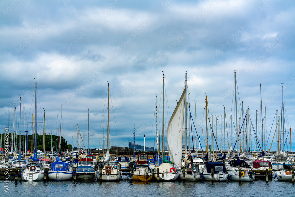 Copenhagen, Denmark - Sep 27th 2020: Sailboats docked side by side in a large marina.
