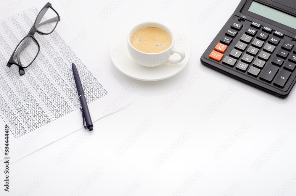 Accounting business concept. Desktop with cup of coffee, calculator, glasses and spreadsheet. Accounting business concept. Desktop with cup of coffee, calculator, glasses and spreadsheet.