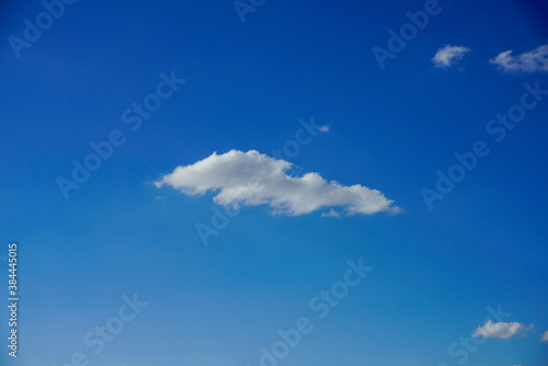 tiny single cloud blue sky minimalist