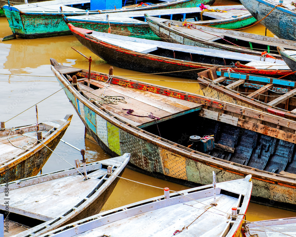 Colorful wooden boats on the Ganges River in Varanasi, India
