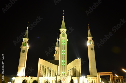 Muslim mosque in the night city. The mosque is illuminated. City mosque. Mosque. Islam.
