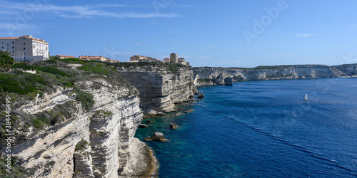 Panorama of the white limestone cliffs and Bonifacio Corsica, sea and blue sky in the background, copy space