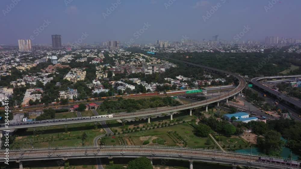 Delhi Metro Janakpuri To Botanical Garden Video „An aerial shot of the Delhi Metro entering Botanical Garden