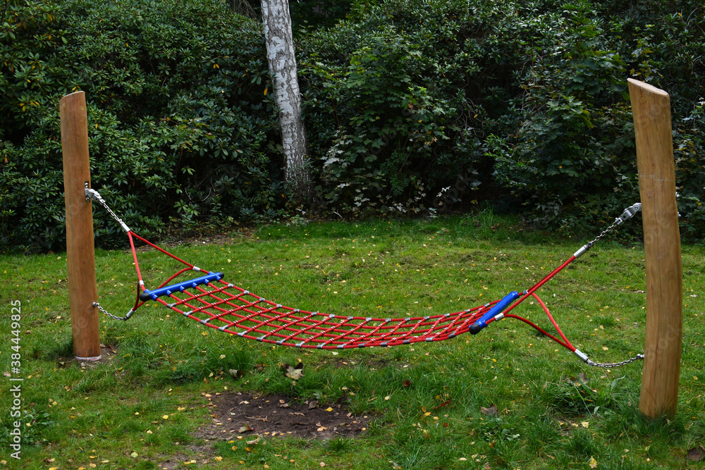 isolated hammock stands in the middle of green forest for relaxation and sleep isolated hammock stands in the middle of green forest for relaxation and sleep