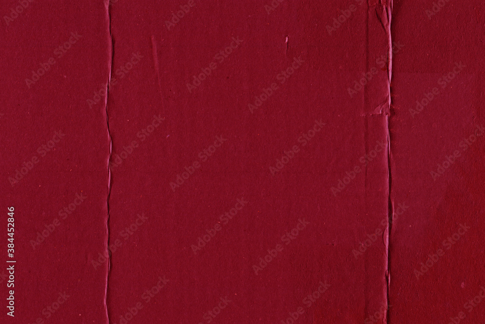 Fototapeta premium A red vintage rough sheet of carton. Recycled environmentally friendly cardboard paper texture. Simple and bright minimalist papercraft background.
