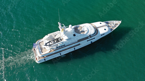 Aerial drone photo of luxury yacht cruising to Athens Marina and port in Piraeus, Attica, Greece © aerial-drone