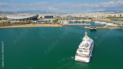 Aerial drone top down photo of luxury yacht cruising to Athens Marina and port in Piraeus, Attica, Greece © aerial-drone
