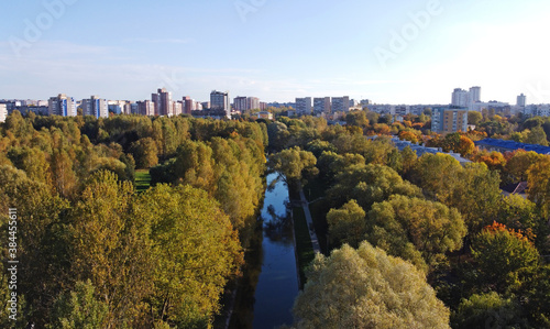 Top view of a beautiful green park with a river