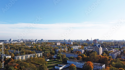 Top view of a beautiful autumn park in the city with houses