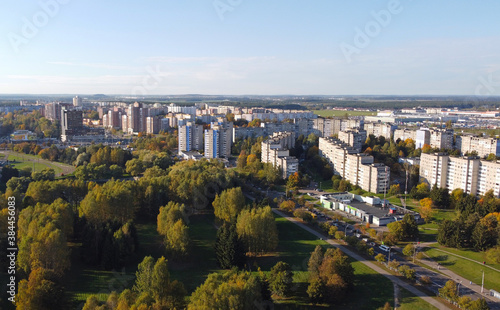 Top view of a beautiful autumn park in the city with houses