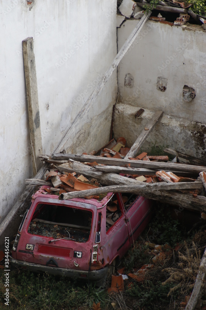 Abandoned house with a car inside
