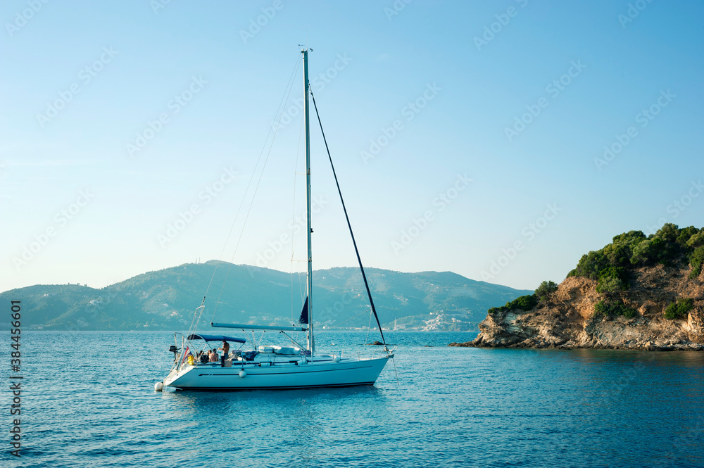 Sailboat off coast island of Skiathos, Greece Sailboat off coast island of Skiathos, Greece
