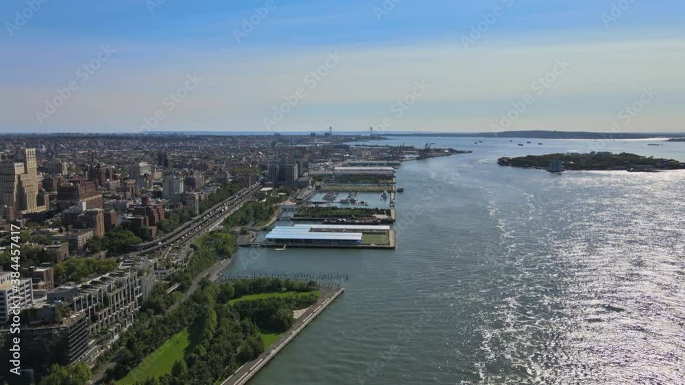 Autumn landscape aerial view of Manhattan skyline with lower Manhattan on large docked ship on the Red Hook Container Terminal Brooklyn, New York NY USA Autumn landscape aerial view of Manhattan skyline with lower Manhattan on large docked ship on the Red Hook Container Terminal Brooklyn, New York NY USA