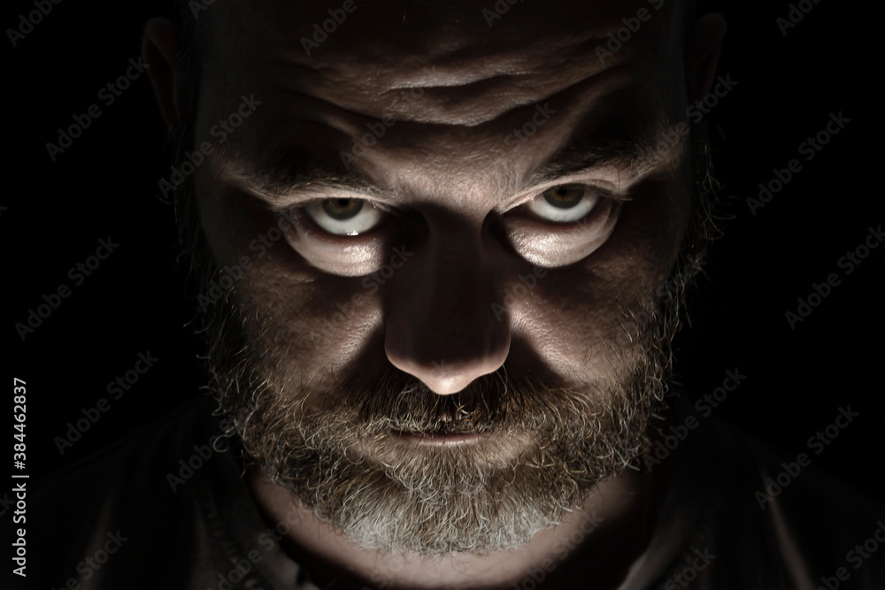Unusual porter of a man with a beard on a black background Unusual porter of a man with a beard on a black background