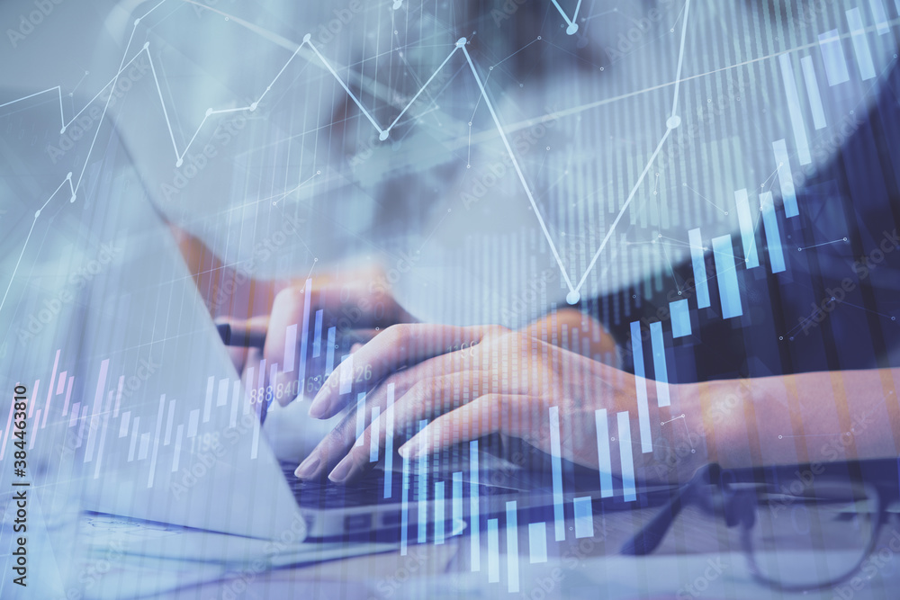 Multi exposure of woman hands typing on computer and financial graph hologram drawing. Stock market analysis concept. Multi exposure of woman hands typing on computer and financial graph hologram drawing. Stock market analysis concept.