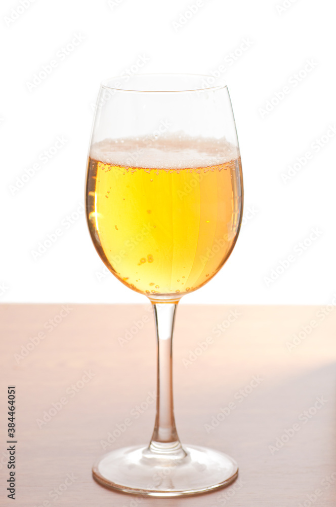 Glass of cold beer over wooden surface Glass of cold beer over wooden surface