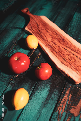 lemon and tomato on wooden table