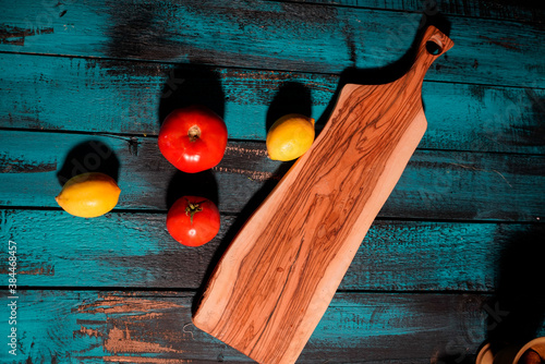 lemon and tomato on wooden table