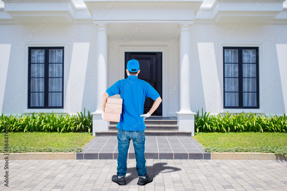 Delivery man standing in front of customers house