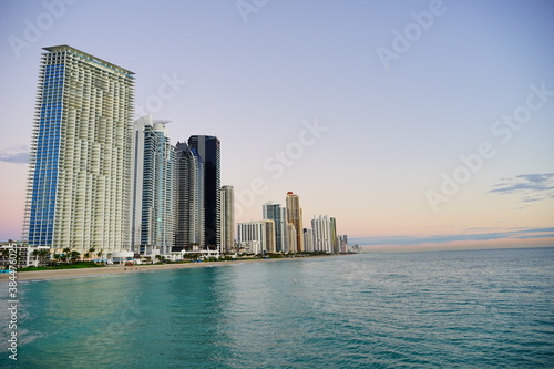 Miami downtown and beach at sun set   © Feng
