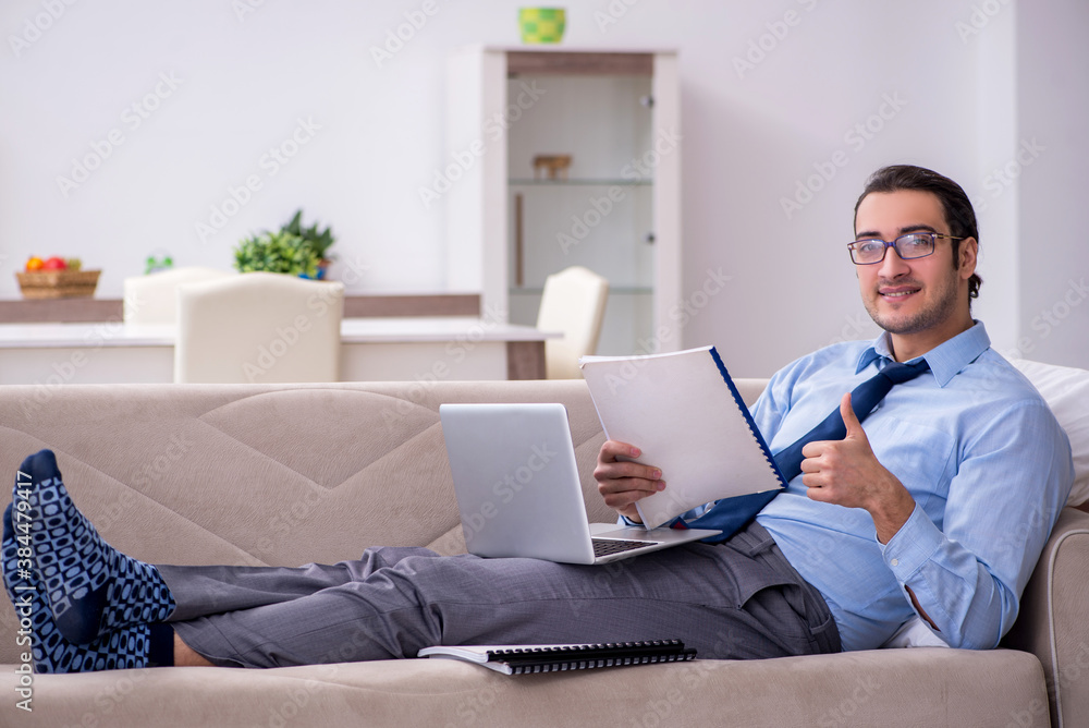 Tired businessman employee working from home