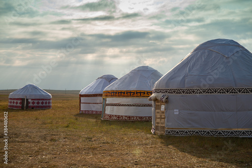 one and several yurts in the Kazakh steppe photo