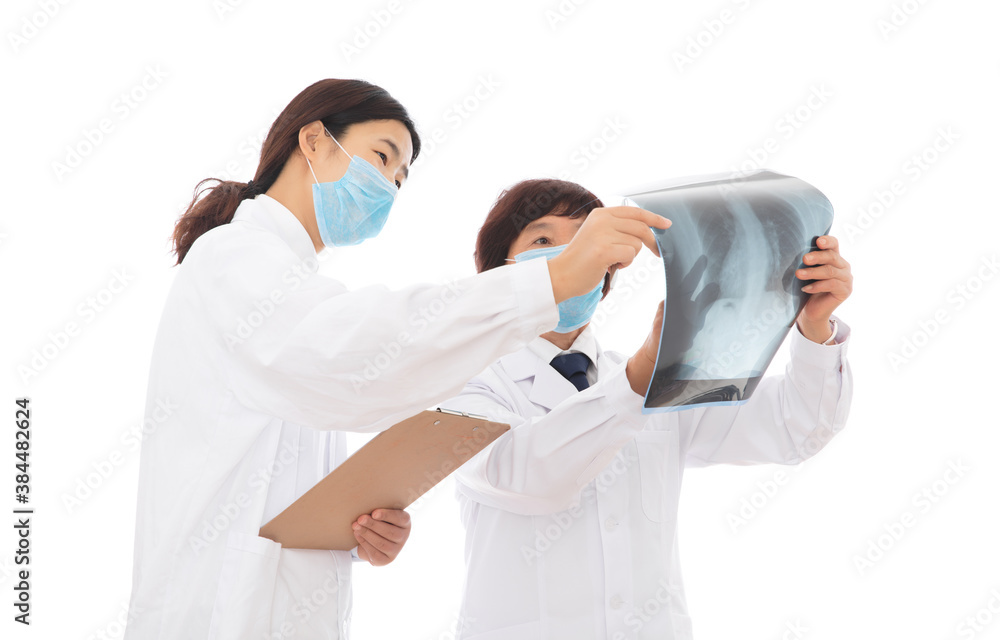 Naklejka premium Medical experts and interns are studying lung X-rays