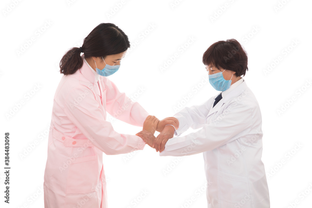 The doctor and the nurse clasped their hands together The doctor and the nurse clasped their hands together