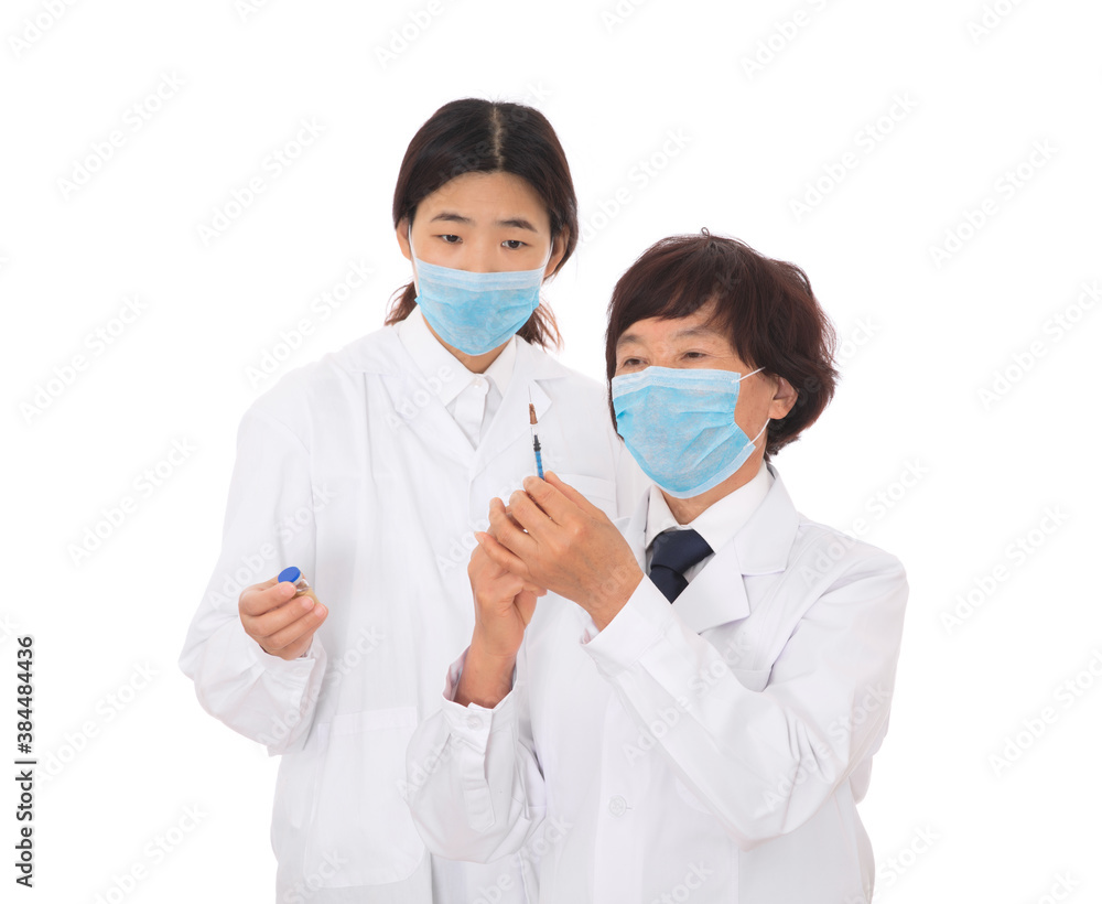The attending physician is guiding the interns The attending physician is guiding the interns