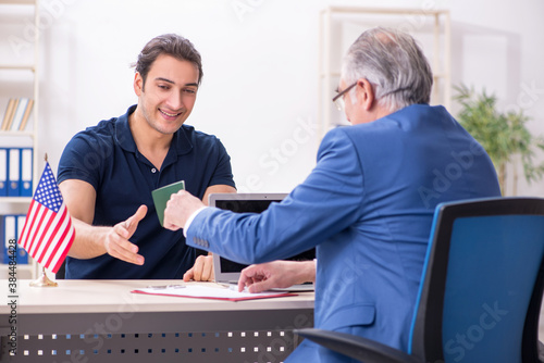 Young man visiting embassy for visa application