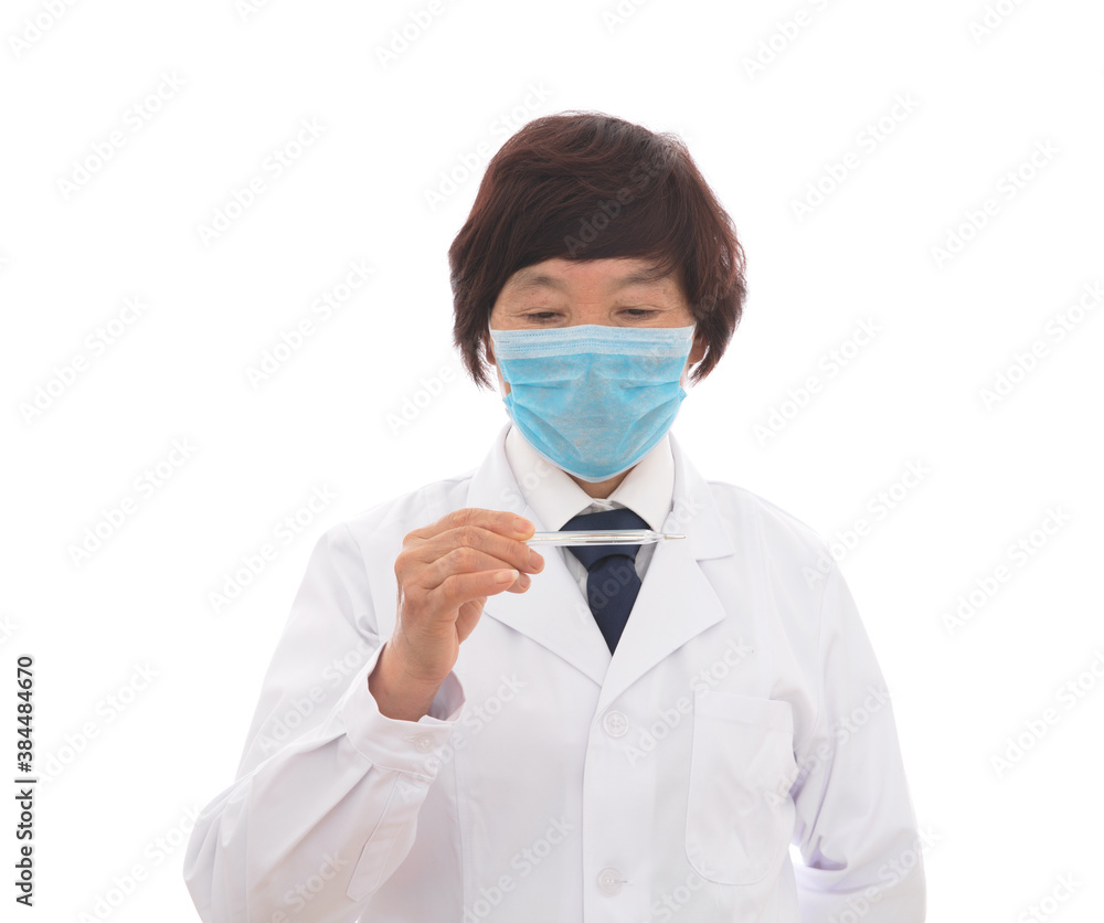 Female doctor wearing a mask checks the clinical thermometer Female doctor wearing a mask checks the clinical thermometer