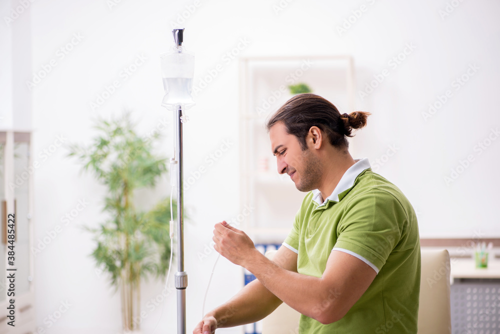 Young male patient in blood transfusion concept Young male patient in blood transfusion concept