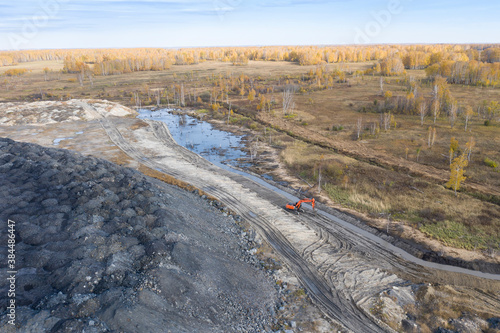 An arial view of a coal opencast mine impending on the wildlife of the Siberian forest in Russia