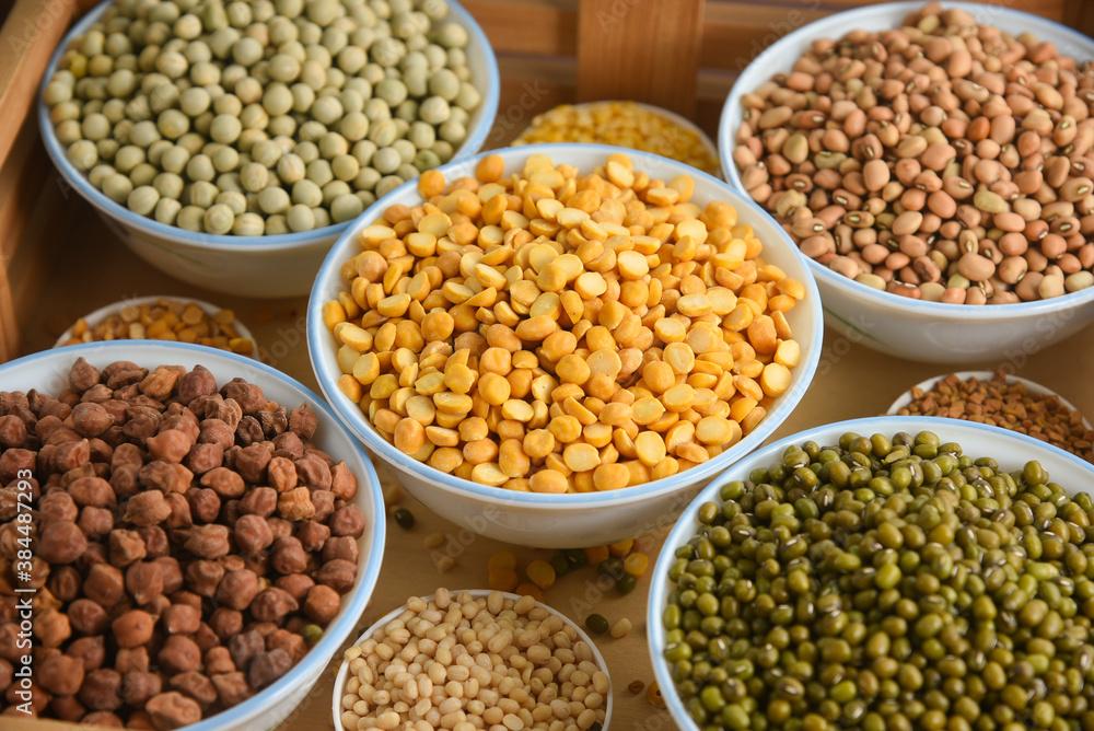 Various sources of vegetable protein beans, lentils, peas, chickpeas, mung bean in bowls. Indian Pulses uncooked , Lentils, Rice healthy balanced diet for vegans and vegetarians. Legumes assortment Various sources of vegetable protein beans, lentils, peas, chickpeas, mung bean in bowls. Indian Pulses uncooked , Lentils, Rice healthy balanced diet for vegans and vegetarians. Legumes assortment