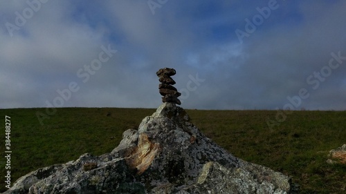 balancing rocks against a cloudy sky