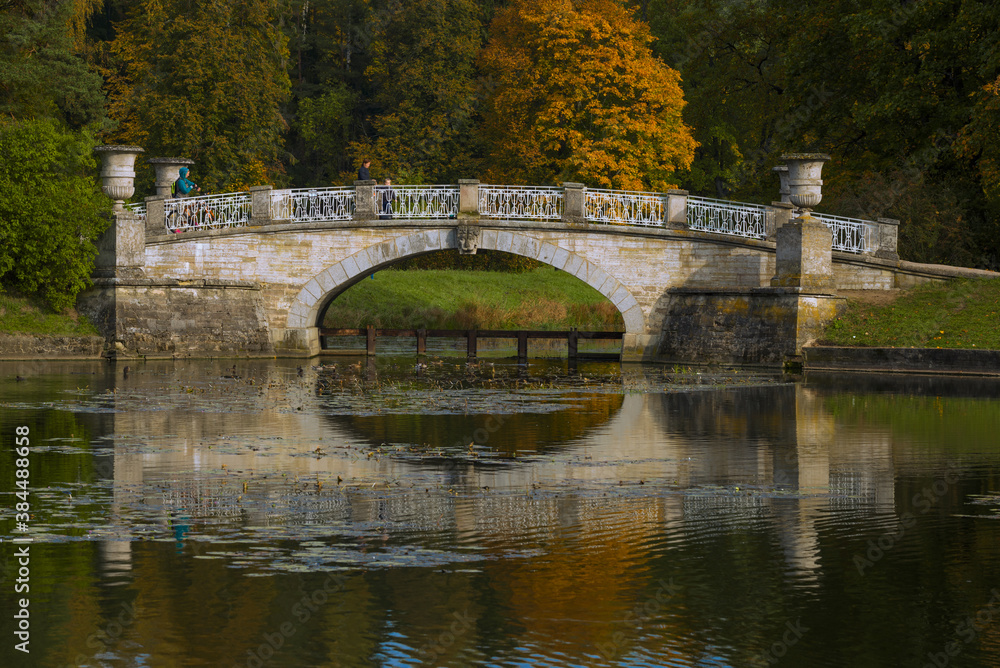 Fototapeta premium Old Viscontiev Bridge close up on September afternoon. Pavlovsk Park