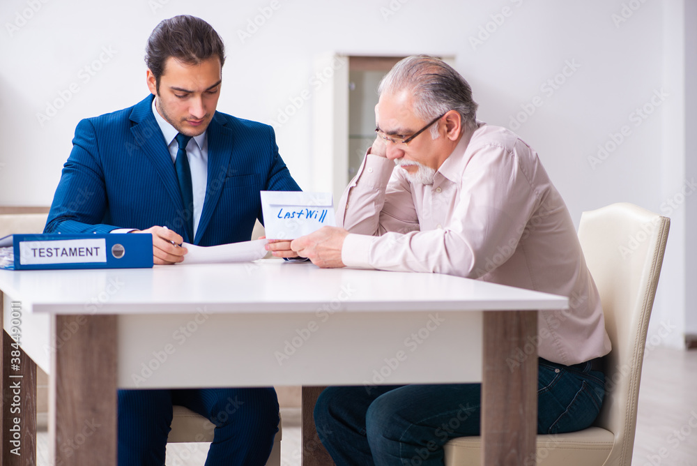Young male lawyer visiting old man in testament concept Young male lawyer visiting old man in testament concept