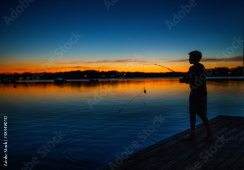 Sunset teen fishing.  Last rays