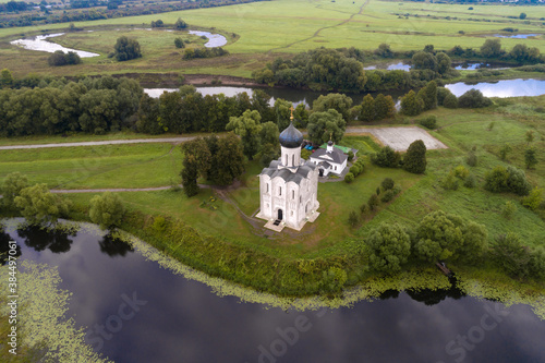 Top view of the ancient Church of the Intercession on the Nerl in August morning (aerial photography). Bogolyubovo, Russia photo