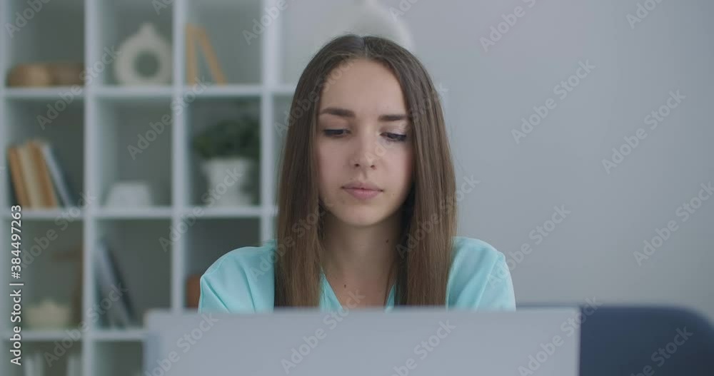 Focused business woman entrepreneur typing on laptop doing research. Young female professional using computer sitting at home office desk. Busy worker freelancer working on modern tech notebook device Focused business woman entrepreneur typing on laptop doing research. Young female professional using computer sitting at home office desk. Busy worker freelancer working on modern tech notebook device