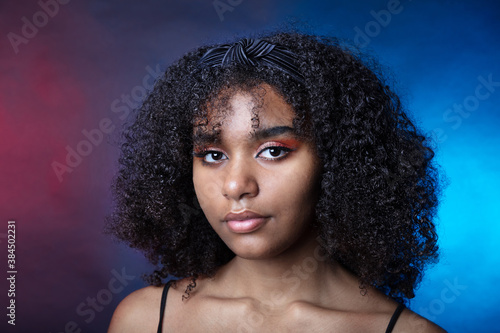 Portrait of a black girl in the studio on a dark background