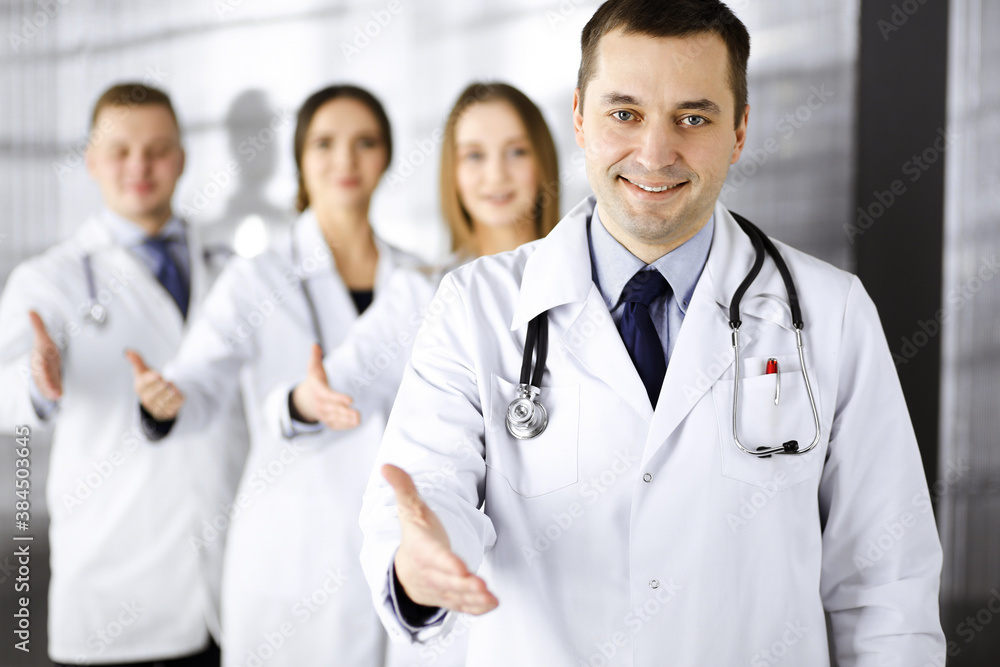 Team of friendly professional doctors are offering their helping hand for the people. Physicians are ready to help their patients. Best medicine concept nowadays Team of friendly professional doctors are offering their helping hand for the people. Physicians are ready to help their patients. Best medicine concept nowadays