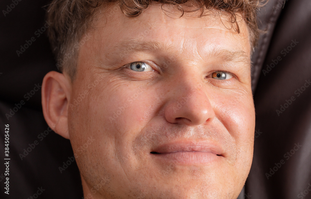 Portrait of a man in a leather chair