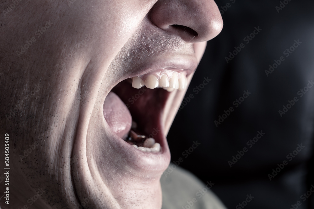 Close-up lips and mouth of a man screaming. Close-up lips and mouth of a man screaming.