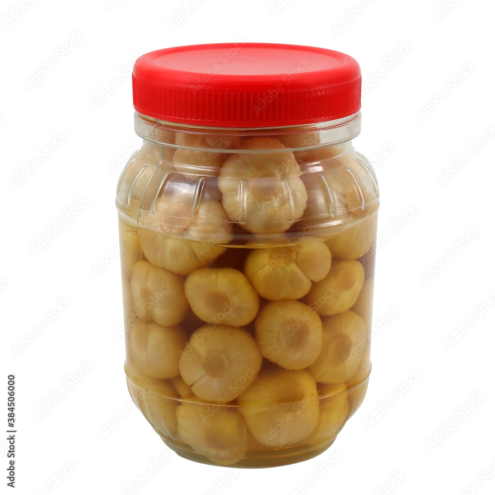 pickled garlic in bottle isolated on white pickled garlic in bottle isolated on white