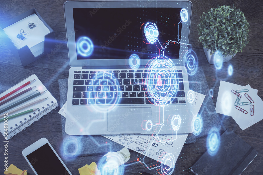 Double exposure of laptop computer and technology theme hologram. Concept of freelance work. Double exposure of laptop computer and technology theme hologram. Concept of freelance work.